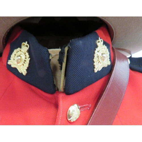 311 - Post 1953 Royal Canadian Mounted Police Uniform
scarlet, single breasted, high collar tunic.  C... 