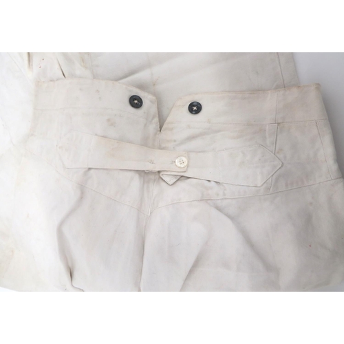 332 - Pair Of Imperial German/Austrian Fatigue Trousers
white, heavy cotton, wide leg, high V back waist t... 