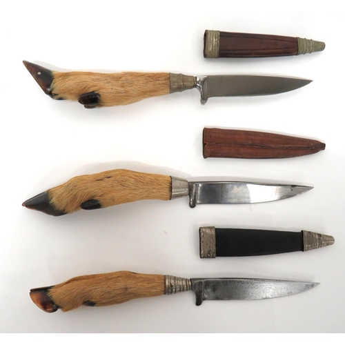 494 - Three Deer Foot Handled Combat/Hunting Knives
single edged blades.  The top with built in cross... 