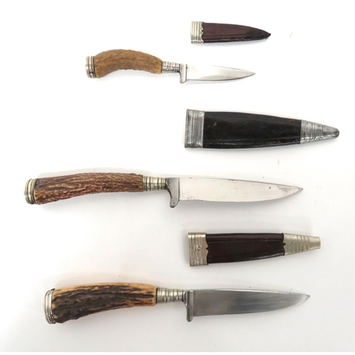 495 - Three Antler Grip Combat/Hunting Knives
single edged blades.  The top with built in cross guard... 