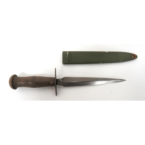 496 - French WW1 Style Combat Knife
7 inch, double edged blade with narrowing forte.  Large, oval, st... 