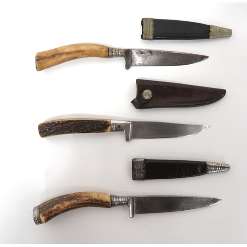 500 - Three Antler Grip Combat/Hunting Knives
single edged blades.  The top with built in cross guard... 