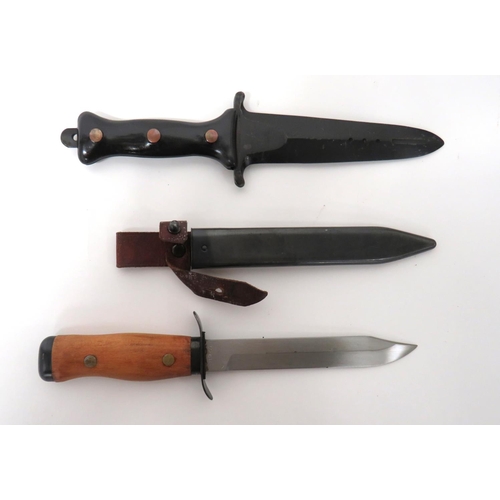 505 - Two Post War Continental Combat Knives
consisting 6 inch, single edged, clipped point blade.  F... 