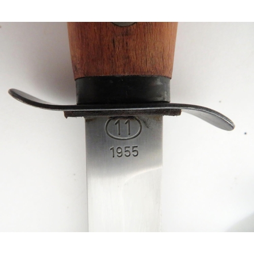 505 - Two Post War Continental Combat Knives
consisting 6 inch, single edged, clipped point blade.  F... 