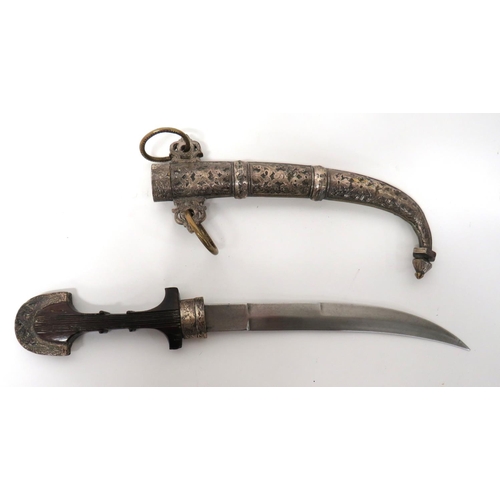 507 - Late 19th Century North African Jambiya
9 inch, double edged, slightly curved blade.  Silvered ... 