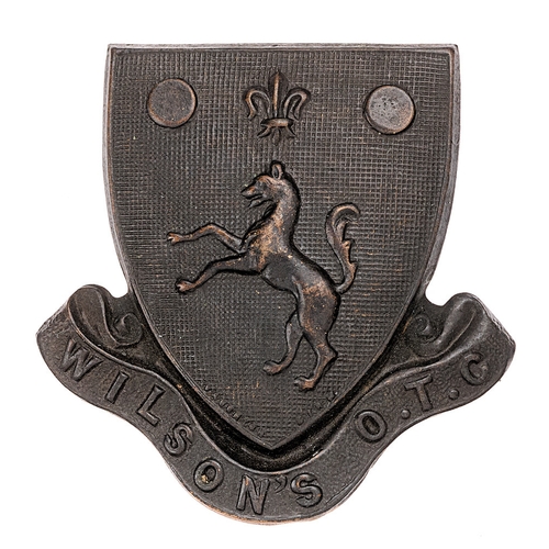 100 - Wilson’s Grammar School OTC (Wallington, Surrey) cap badge.  Good scarce die-stamped bronzed shield,... 