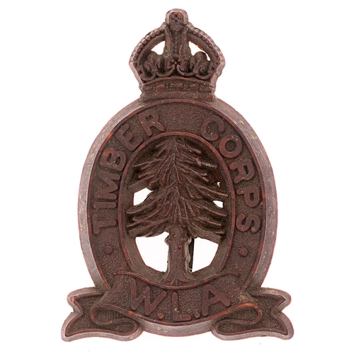 130 - Timber Corps, Women’s Land Army WW2 plastic cap badge.   Good scarce reddy brown crowned title oval ... 