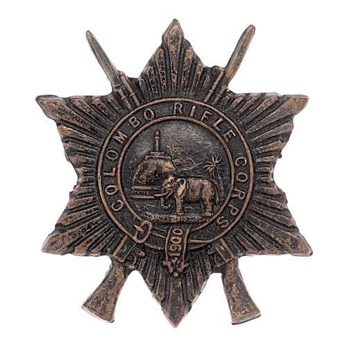 194 - Colombo Rifle Corps Ceylon cap badge.  Good scarce British die-stamped blackened brass example. Supe... 