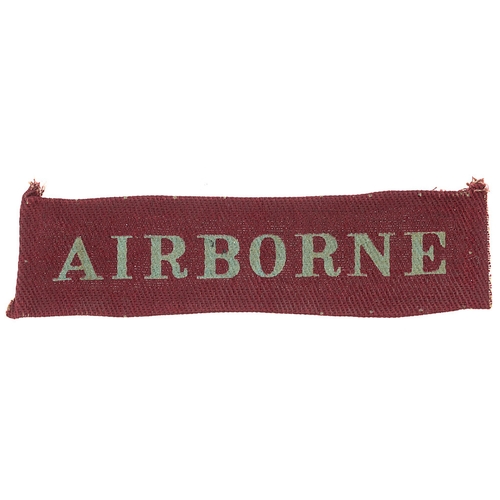 251 - AIRBORNE WW2 printed cloth arm strip c. 1942-44. Good scarce light blue serif letters printed on mar... 