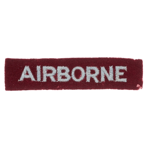 252 - AIRBORNE WW2 cloth embroidered arm strip c. 1942-44.  Good scarce light blue sans-serif letters embr... 