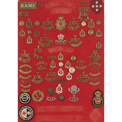 296 - Royal Army Medical Corps badges, shoulder titles etc.  Board with good display of approx. 73 metal a... 