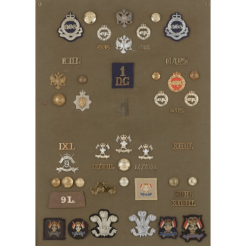 302 - Dragoon Guards and Lancer badges, shoulder titles etc.  Board with good display of approx. 49 metal ... 