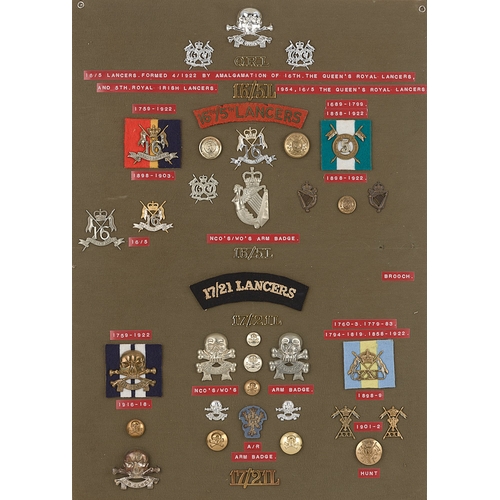 303 - Lancer badges, shoulder titles etc.  Board with good display of approx. 39 metal insignia including ... 