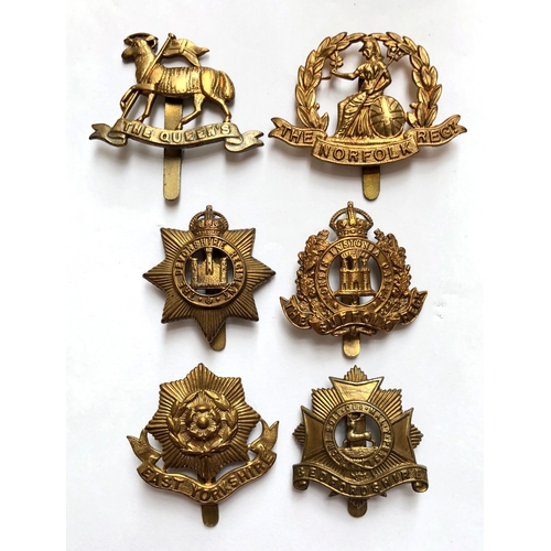 315 - 6 All brass 1916 economy issue Infantry cap badges.  Queen's ... Norfolk ... Devon ... Suffolk ... E... 