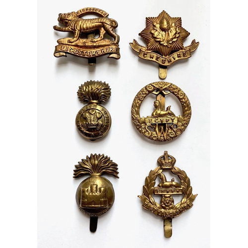 316 - 6 All brass 1916 economy issue Infantry cap badges.  Leicestershire ... Cheshire ... R. Welsh Fusili... 