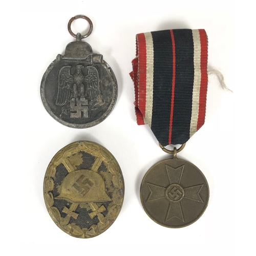 467 - German Third Reich Eastern Front Medal, War Merit Medal and Wound Badge.  Eastern Front Medal lackin... 