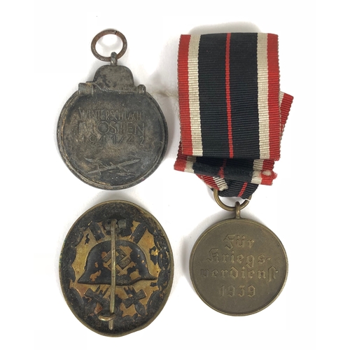 467 - German Third Reich Eastern Front Medal, War Merit Medal and Wound Badge.  Eastern Front Medal lackin... 