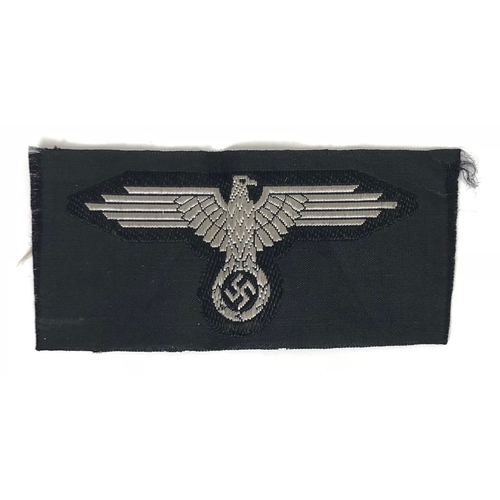 488 - German Third Reich Waffen SS cloth cap eagle.  Good scarce BeVo silver grey eagle and swastika on bl... 