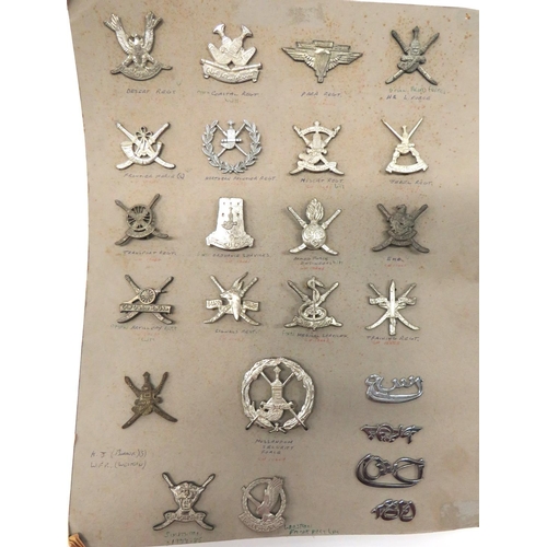 1 - 20 Sultan of Oman Military Head-Dress Badges
including Airborne Regiment ... Engineers ... Artillery... 