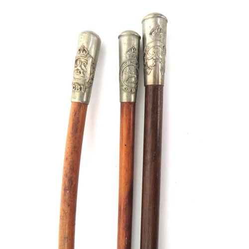 146 - Four Military Swagger Sticks
consisting white metal thimble top with KC Cyprus Police badge.  M... 