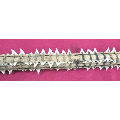 153 - 19th Century South Seas Shark Tooth Tebutje Spear
wooden shaft with four rattan bound rows of shark ... 