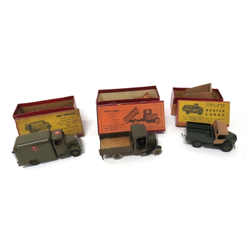 Three W Britain Boxed Military Transport Vehicles
consisting boxed number 1334 Army lorry (with driver).  One door absent ... Boxed number 1512, Army ambulance.  Wounded man but stretcher absent ... Boxed number 1877, Beetle lorry (with driver).  Some wear.  3 items.