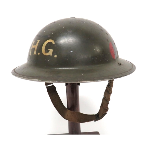 190 - WW2 Divisional Badged Home Guard MKII Steel Helmet
khaki green painted shell.  The front with w... 