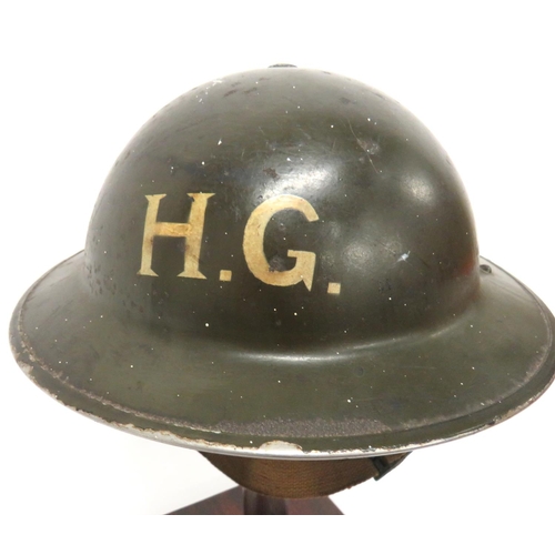 190 - WW2 Divisional Badged Home Guard MKII Steel Helmet
khaki green painted shell.  The front with w... 