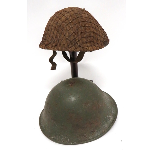 192 - British MKIII Steel Helmet
dark brown external finish.  High rivets to secure the chinstrap mounts. ... 