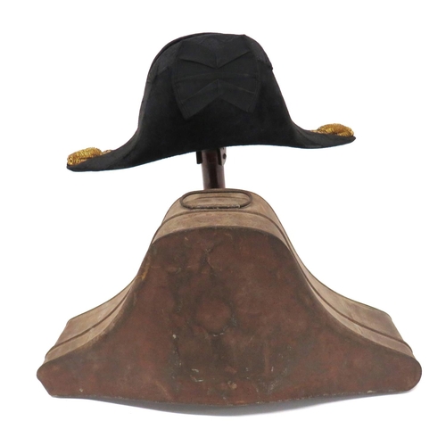 194 - Royal Navy Officer's Bicorn Hat
black beaver bicorn.  Black, acorn decorated braid edging. &nbs... 