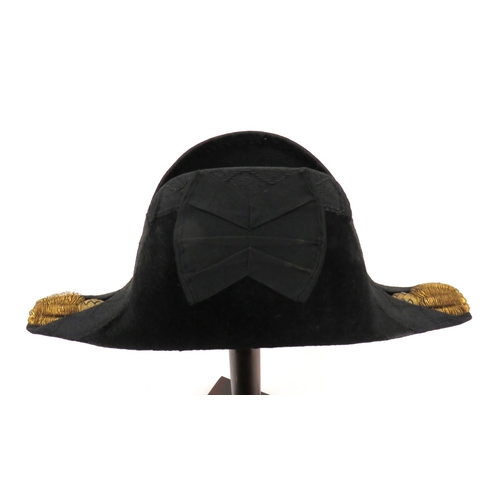 194 - Royal Navy Officer's Bicorn Hat
black beaver bicorn.  Black, acorn decorated braid edging. &nbs... 