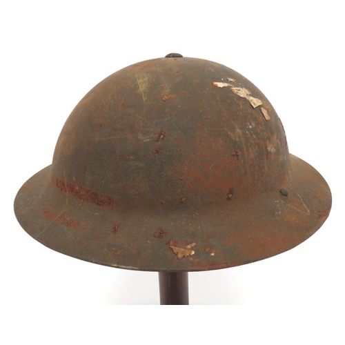 196 - WW2 MKII 2nd Line Service Steel Helmet
khaki painted crown (some rusting).  One rim side with two dr... 