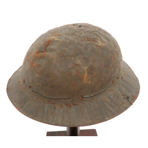 197 - WW2 Child's Steel Helmet
pressed sheet tin helmet.  Rolled brim edge.  Period fitted with a Zuckerma... 