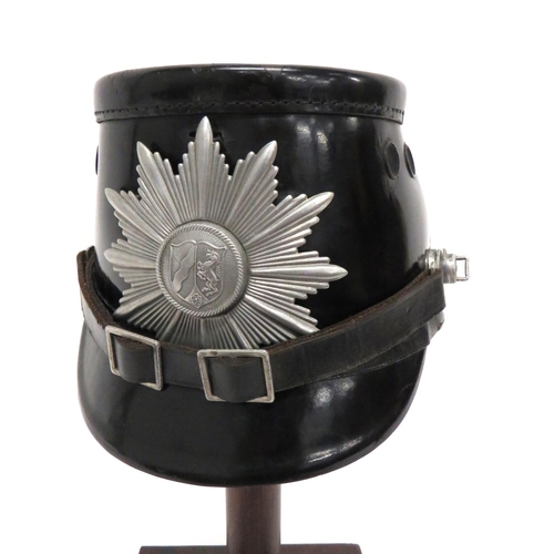 199 - Post War German Police Shako
black composite body, crown and brim.  Front alloy North Rhine Wes... 