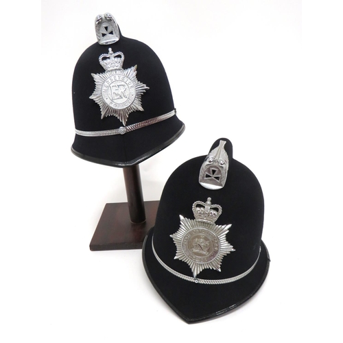 200 - Two Post 1953 Police Constabulary Helmets
black felt covered, crested top helmets.  Pointed pea... 