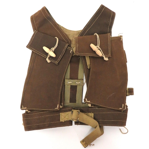 224 - WW2 Skeleton Assault Jerkin
brown canvas, chest magazine pouches.  Top flaps secured by wooden ... 