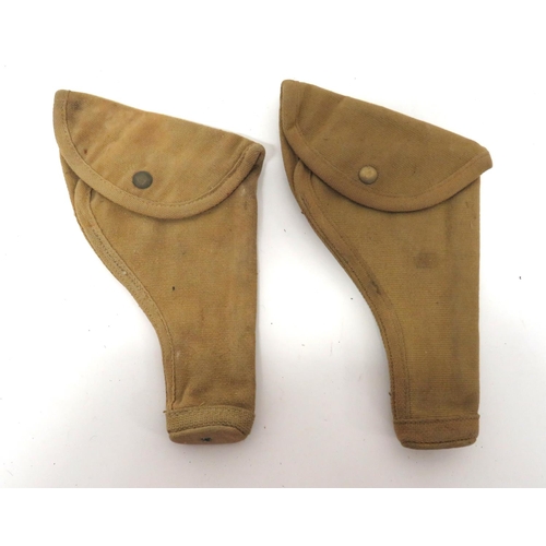 234 - Two Canadian Pattern Colt/Revolver Holsters
khaki tan canvas holsters.  Top flap secured by bra... 