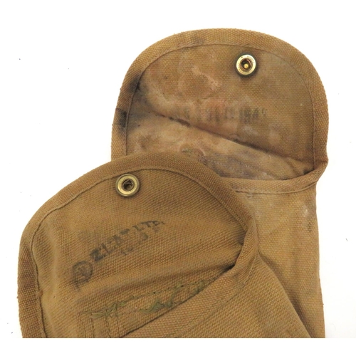 234 - Two Canadian Pattern Colt/Revolver Holsters
khaki tan canvas holsters.  Top flap secured by bra... 