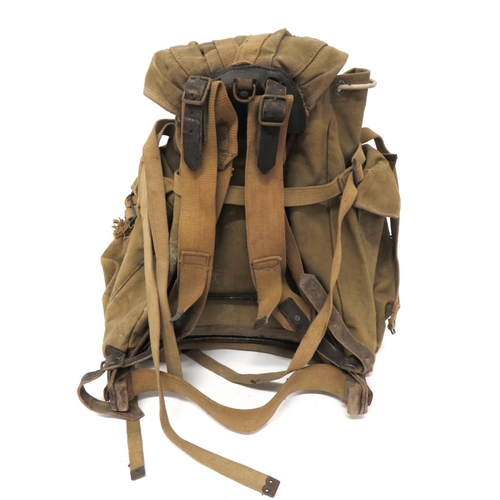 239 - WW2 Pattern Commando Rucksack
heavy green canvas rucksack.  Pockets to the front and sides, all... 