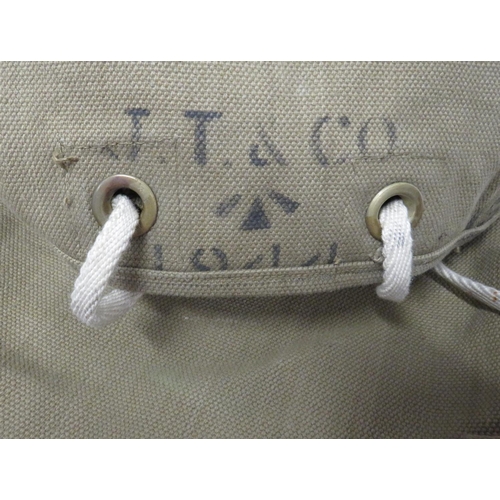 255 - WW2 Dated Ammunition Transport Vest
khaki, large chest and back, open top bags with cord fixing. Web... 