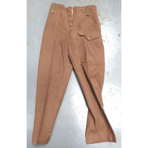 325 - Pair Of 1946 Battledress Trousers
khaki woollen, wide leg trousers.  Large, front patch pocket ... 