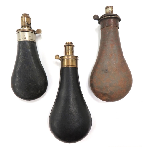 438 - Three Leather Covered Body Powder Flasks
consisting black leather covered body.  Brass top with... 