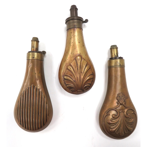 439 - Three 19th Century Powder Flasks
consisting brass body with shell design.  Brass top with hidde... 