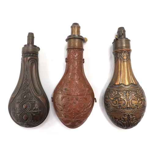 440 - Three 19th Century Powder Flasks
consisting copper, floral scroll design, bag body.  Brass top ... 