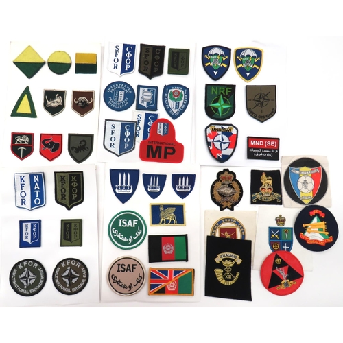 68 - 89 x Various Post War Cloth Badges
including Multinational Brigade West ... Multinational Brigade Ea... 