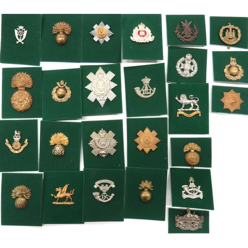 81 - 25 x Infantry Cap Badges
including plated KC Suffolk Reg ... Brass KC Royal Scots Fus ... Brass RMLI... 