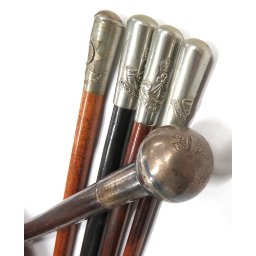 104 - Five Various Military Swagger Sticks
consisting white metal thimble top, KC Kings African Rifles ...... 