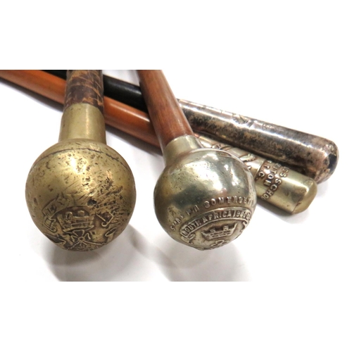 106 - Four Various English Swagger Sticks
consisting silver hallmarked thimble top, 2nd VB Somerset LI ...... 