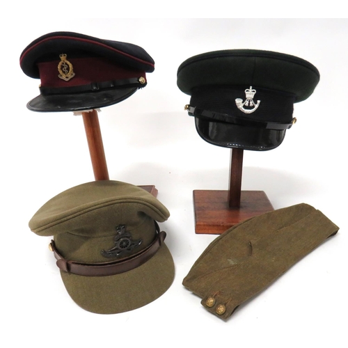 Four Various Hats Including Post War
consisting khaki, Other Ranks field service cap. &nbsp;Brass, General List buttons. &nbsp;Some wear .... Khaki, Officer's post war service dress cap. &nbsp;Bronzed QC RA badge and anodised buttons ... Green, Officer's Light Infantry dress cap. &nbsp;Silvered, QC Light Infantry badge ... Black and maroon dress cap. &nbsp;Silvered and gilt QC RAMC cap badge and anodised buttons. &nbsp;4 items.