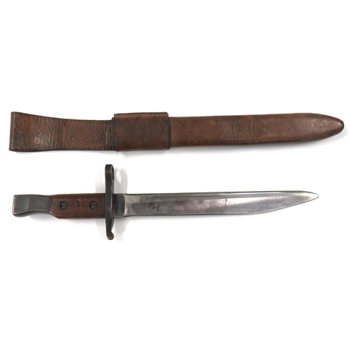 Canadian M1910 Modified Point Ross Bayonet
10 inch, single edged blade with sharpened point.  Blued steel muzzle ring, crossguard and pommel.  Pommel marked "Ross Rifle Co Quebec".  Dated 12/15.  Wooden slab grips.  Complete in its leather scabbard with fixed frog.  